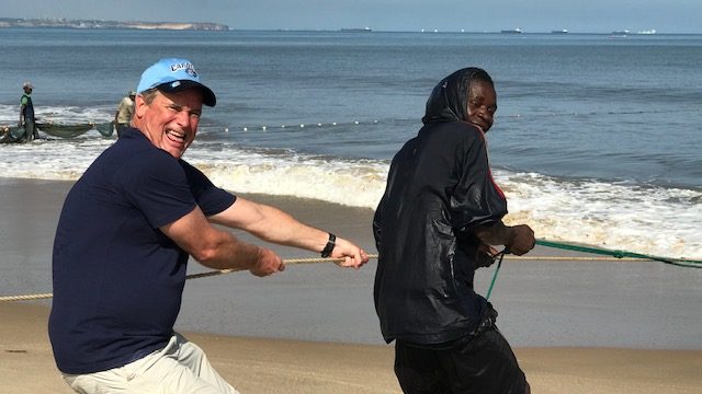 Helping the local fishermen pull in the nets ... of trash