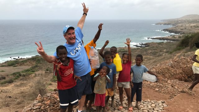 Yukking it up with some local kids who had walked 4 miles to go to the beach!